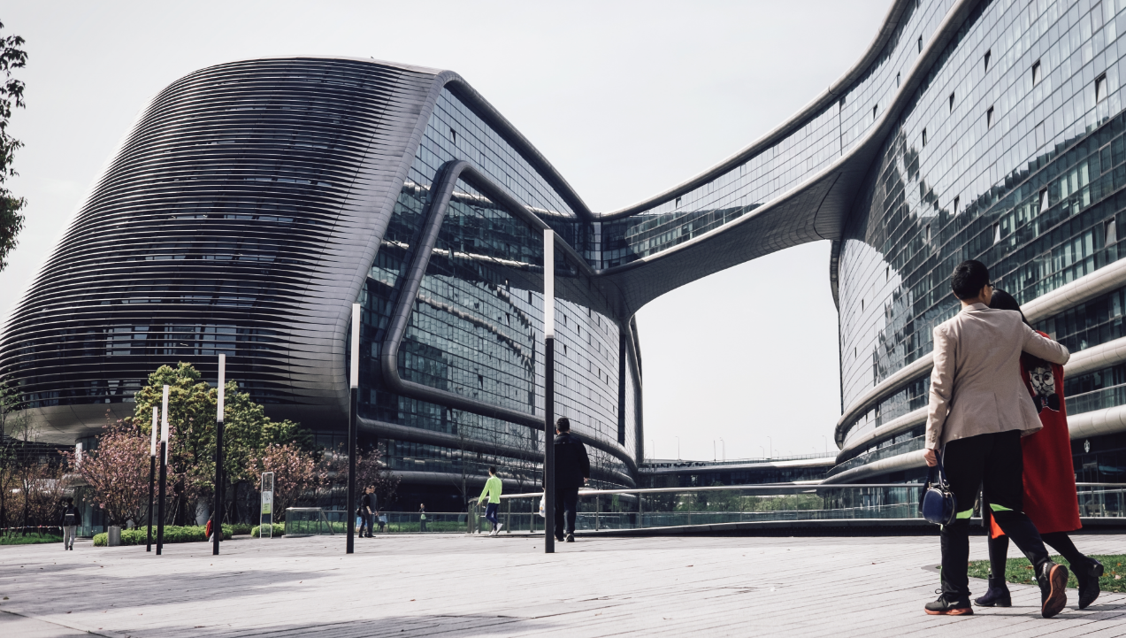 Curved glass covered futuristic building.